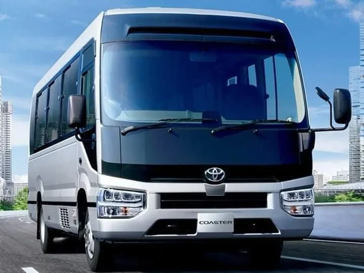 Toyota Coaster, white, front three-quarter view
